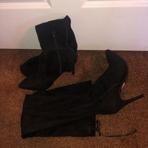 Above the knee black heeled boots
